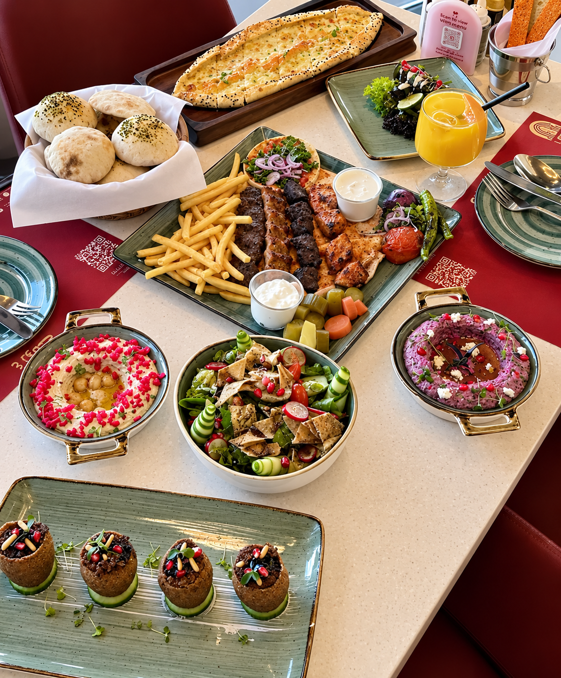 A table of grilled meats, salads, bread and mezze at Badawi Lebanese Restaurant.
