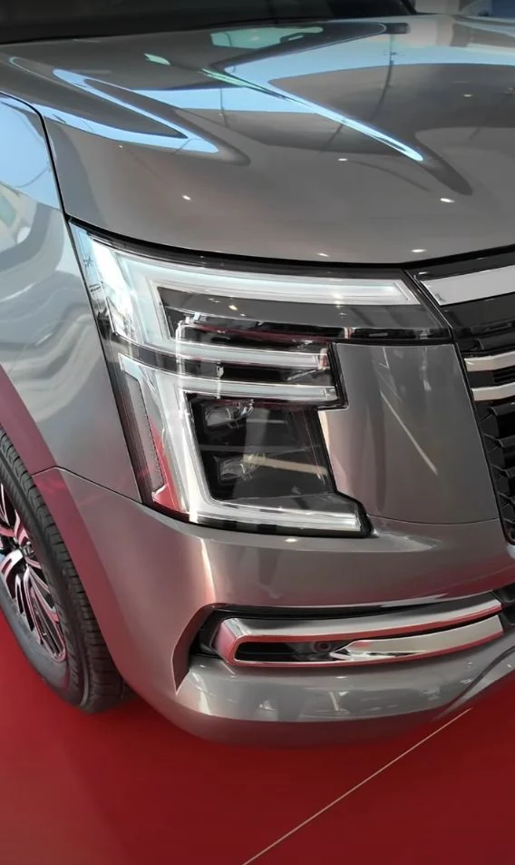 Nissan Patrol headlight and grille detail.